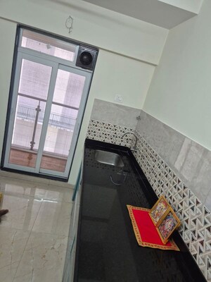 Kitchen in 2 BHK Apartment at Mahavir Square, Manpada – for Rent