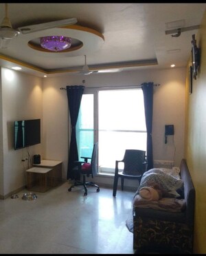 Living Room in 1.5 BHK Apartment at Dosti Oak, Balkum Pada – for Rent