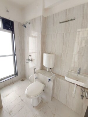 Bathroom in 2 BHK Apartment at Puranik City, Kasarvadavali – for Rent