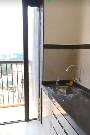 Kitchen in 2 BHK Apartment at Dhamji Shamji Mahavir Spring Tulip Phase 1, Pokhran Road No Two – for Rent