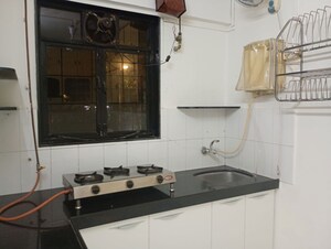 Kitchen in 1 BHK Apartment at Sun & Breeze Apartment, Vile Parle East – for Rent