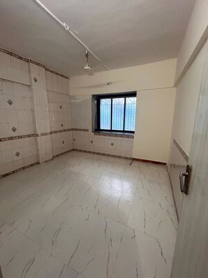 Bathroom in 1 BHK Apartment at Jalmeena CHS, Vile Parle East – for Rent