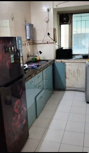 Kitchen in 2 BHK Apartment at Omkar CHS, Parel – for Rent