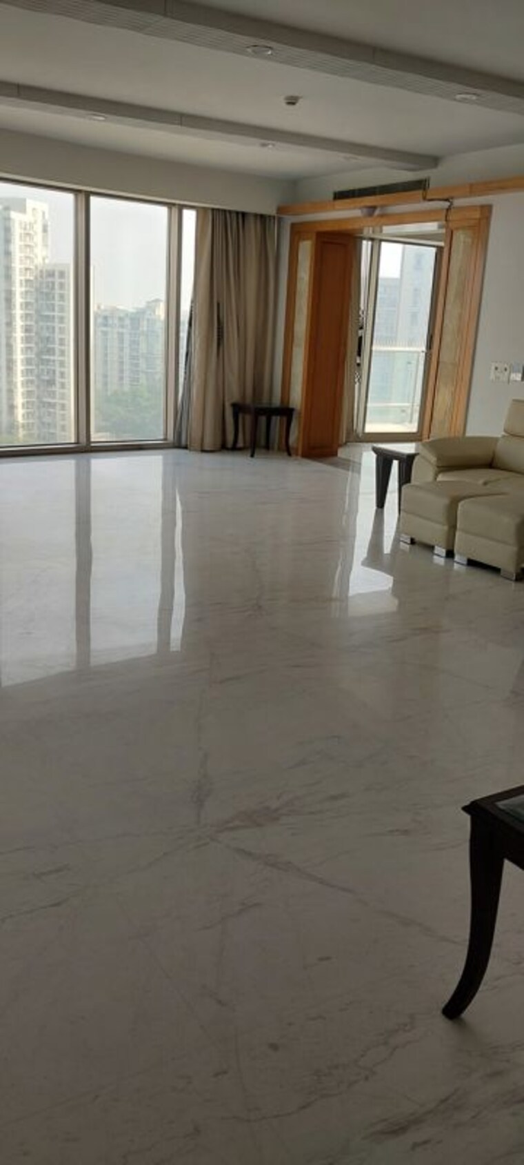 Living Room, jaypee-green-sun-court-tower-iii 3 Bedroom 3810 Sq.Ft. Apartment In Jaypee Greens Greater Noida 10629101