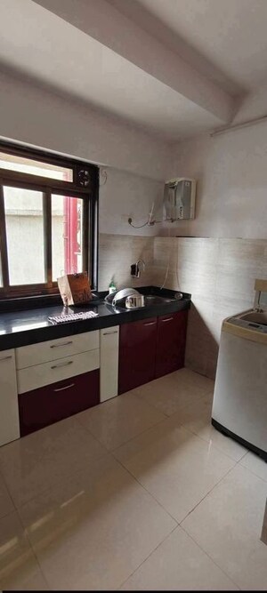 Kitchen in 1.5 BHK Apartment at Chandiwala Pearl Heaven, Andheri East – for Sale