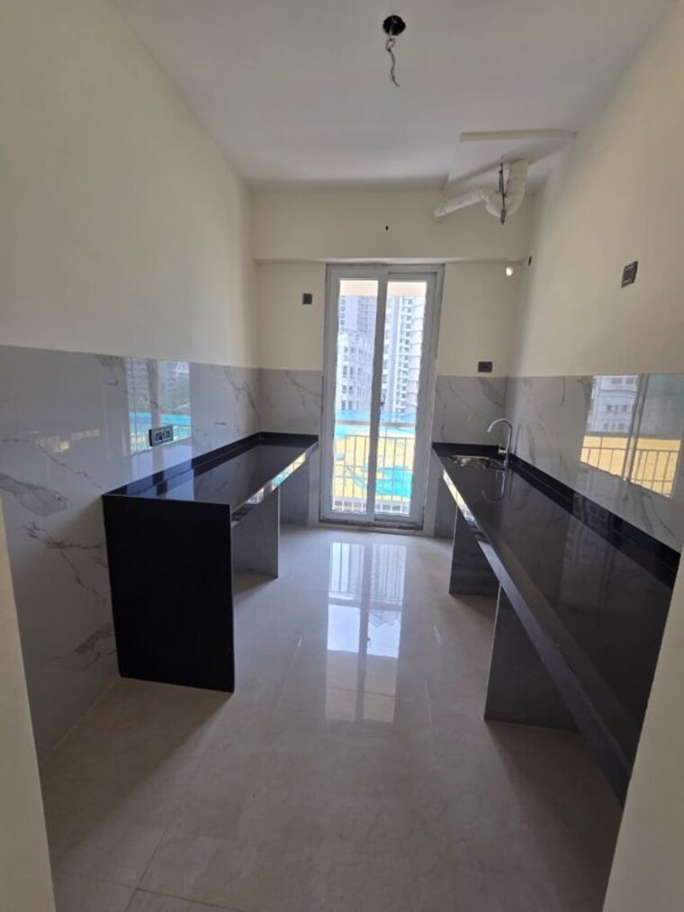 Kitchen, ruparel-sky-green 2 Bedroom 619 Sq.Ft. Apartment In Kandivali West Mumbai 10739087