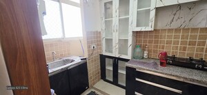 Kitchen in 2 BHK Apartment at Mahagun Mywoods, Sector 16c Greater Noida – for Rent