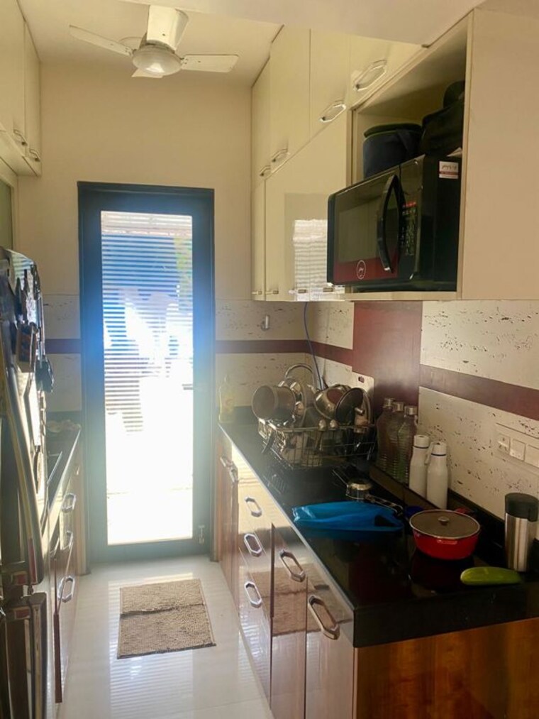 Kitchen, garden-view-apartment 2.5 Bedroom 845 Sq.Ft. Apartment In Goregaon East Mumbai 10739369