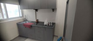 Kitchen in Studio Apartment at DLF Capital Greens Phase I And II, Moti Nagar – for Rent