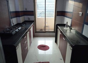 Kitchen in 2 BHK Apartment at Dosti Group Imperia, Manpada – for Rent