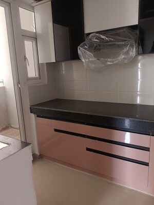 Kitchen in 2 BHK Apartment at Shri Radha Aqua Garden, Sector 16b Greater Noida – for Rent