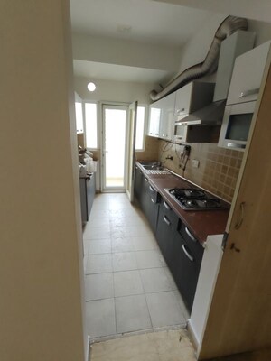 Kitchen in 2.5 BHK Apartment at Mahagun Moderne, Sector 78 – for Sale