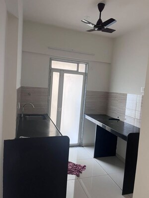 Team Area in 1 BHK Apartment at Godrej Nirvaan, Themghar – for Rent