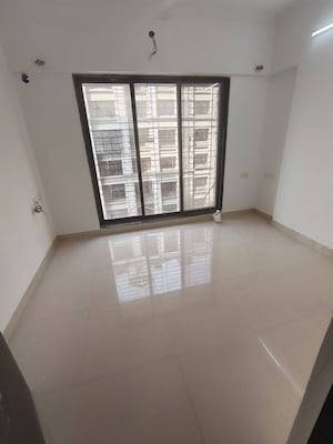 Room in 2 BHK Apartment at Sethia Kalpavruksh Heights, Kandivali West – for Rent