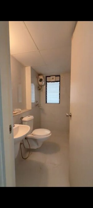 Bathroom in 1 BHK Apartment at Runwal Gardens, Dombivli East – for Rent