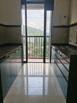 Kitchen in 2 BHK Apartment at Dhamji Shamji Mahavir Spring Tulip Phase 1, Pokhran Road No Two – for Rent