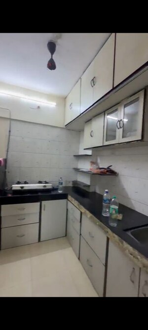 Kitchen in 1 BHK Apartment at Andheri CHS, Andheri West – for Rent