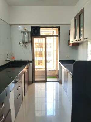 Kitchen in 2 BHK Apartment at Piramal Vaikunth, Balkum Pada – for Rent