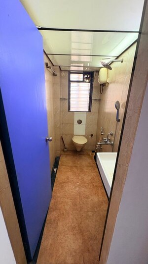Bathroom in 2 BHK Apartment at Millionaire Heritage, Andheri West – for Rent