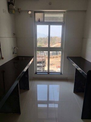Kitchen in 1.5 BHK Apartment at Godrej Emerald, Ghodbunder Road – for Rent