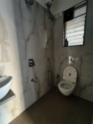 Bathroom in 1 BHK Apartment at Rishabraj Pride, Dahisar West – for Rent