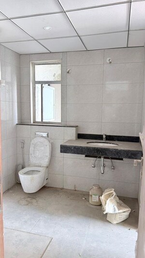 Bathroom in 1.5 BHK Apartment at Suntwilight Phase 2, Sector 27 Yamuna Expressway – for Rent