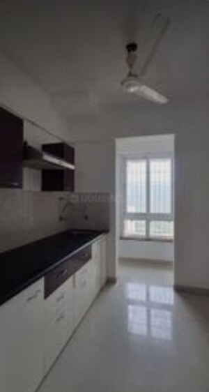 Kitchen in 1.5 BHK Apartment at Puranik Rumah Bali Phase III, Ghodbunder Road – for Rent