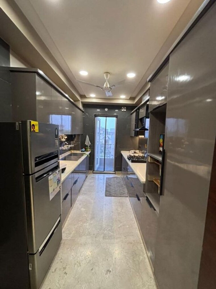 Kitchen, freedom fighters enclave 4 Bedroom 3000 Sq.Ft. Apartment In Freedom Fighters Enclave Delhi 10743177