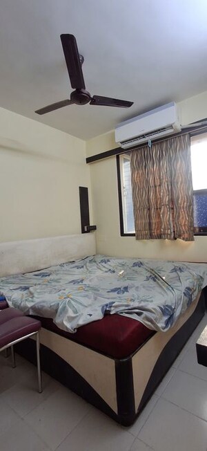 Bedroom in 2 BHK Apartment at Sheth Vasant Sagar Complex, Kandivali East – for Rent