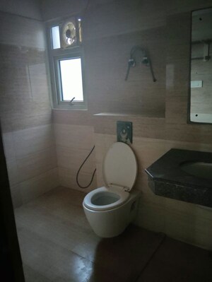 Bathroom in 2 BHK Apartment at Aims Golf City, Sector 75 – for Rent