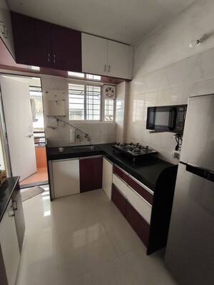 Kitchen in 2 BHK Apartment at Sai Life Style, Dhanori – for Rent