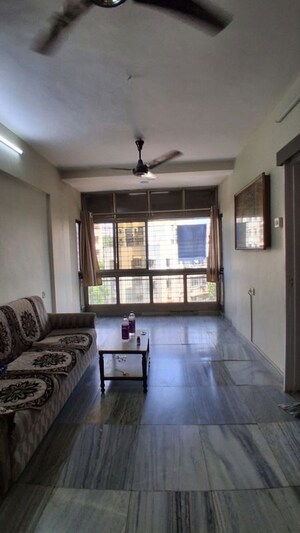 Living Room in 1 BHK Apartment at Panchavati Gardens, Malad East – for Rent