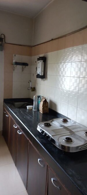 Kitchen in 1 BHK Apartment at Cosmos Heritage, Manpada – for Rent