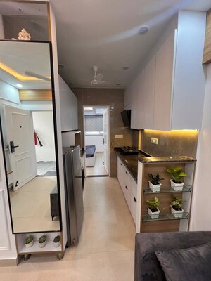Kitchen in Studio Apartment at DLF Capital Greens Phase I And II, Moti Nagar – for Rent