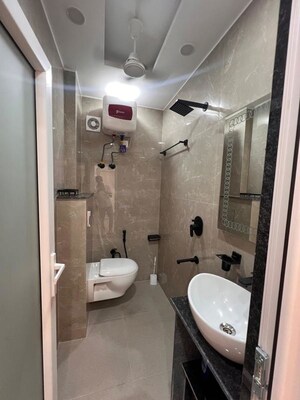 Bathroom in Studio Apartment at DLF Capital Greens Phase I And II, Moti Nagar – for Rent