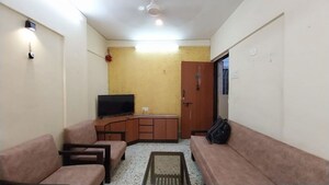 Living Room in 1 BHK Apartment at Lokhandwala House, Khar West – for Rent
