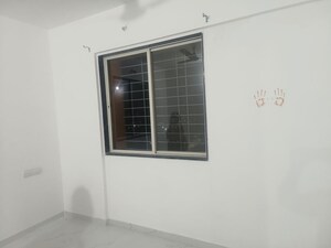 Room in 2 BHK Apartment at Ishwar Parmar River Residency, Chikhali – for Rent