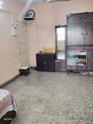 Living Room in 1 BHK Apartment at Juhu Gulmohar CHS, Vile Parle West – for Sale