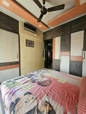 Bedroom in 2 BHK Apartment at Sheth Vasant Lawns, Laxmi Nagar – for Rent