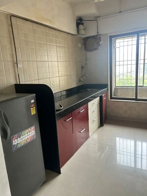 Kitchen in 2 BHK Apartment at Shubharambh Complex, Manpada – for Rent
