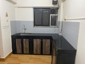 Kitchen in 2 BHK Apartment at Eden Woods complex, Manpada – for Rent