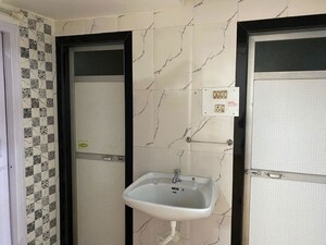 Bathroom in 2 BHK Apartment at Eden Woods complex, Manpada – for Rent