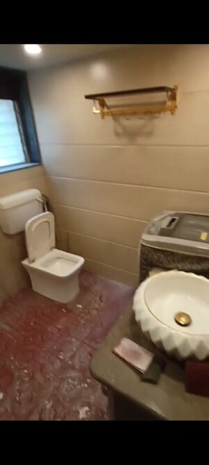 Bathroom in 1 BHK Apartment at Andheri CHS, Andheri West – for Rent
