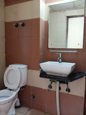 Bathroom in 3 BHK Apartment at Mahagun My Woods, Sector 16c Greater Noida – for Rent