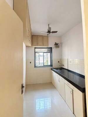 Kitchen in 1 BHK Apartment at Andheri CHS, Andheri West – for Rent