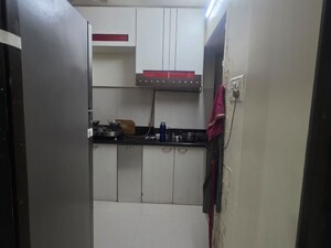 Kitchen in 3 BHK Apartment at Riddhi Gardens CHS, Malad East – for Sale