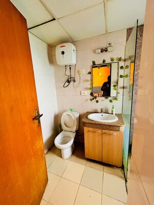 Bathroom in 1 RK Apartment at Nimbus The Golden Palm, Sector 168 – for Rent