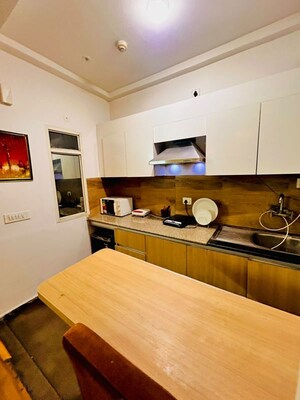 Kitchen in 1 RK Apartment at Nimbus The Golden Palm, Sector 168 – for Rent