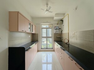 Kitchen in 3 BHK Apartment at Godrej Emerald, Ghodbunder Road – for Rent