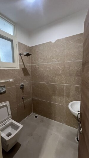 Bathroom in 3 BHK Apartment at Dhakoli – for Rent